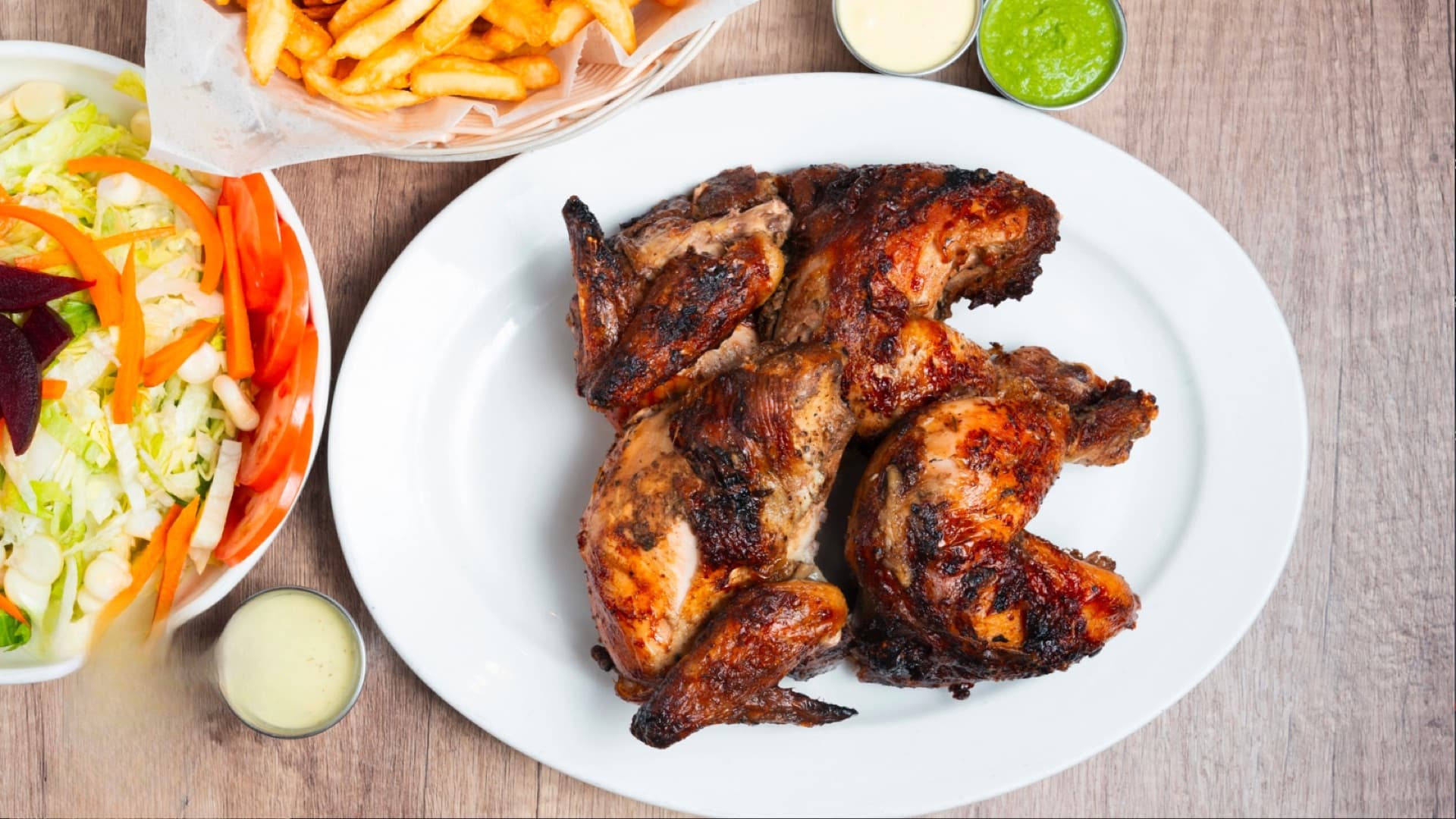 Pollo a la Brasa — Taty's Chicken signature Peruvian charcoal rotisserie chicken